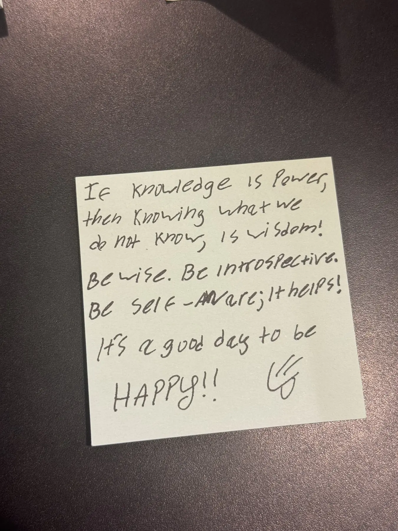 Handwritten sticky note with words of encouragement